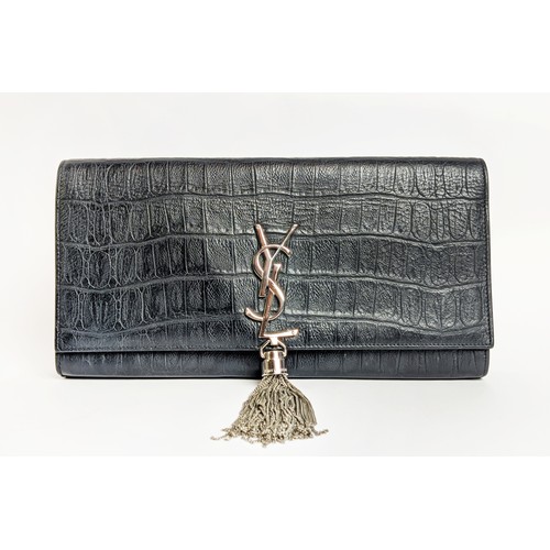 34 - YVES SAINT LAURENT CLUTCH, embossed leather body, metal iconic logo with tassel closure, front flap ... 