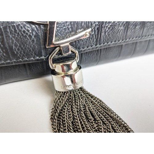 34 - YVES SAINT LAURENT CLUTCH, embossed leather body, metal iconic logo with tassel closure, front flap ... 