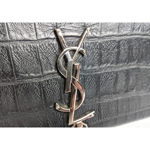 34 - YVES SAINT LAURENT CLUTCH, embossed leather body, metal iconic logo with tassel closure, front flap ... 