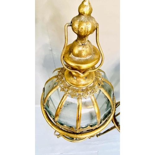 353 - STORM LANTERNS ON STANDS, 115cm H x 34cm diam., Regency style, gilt metal frames. (2)