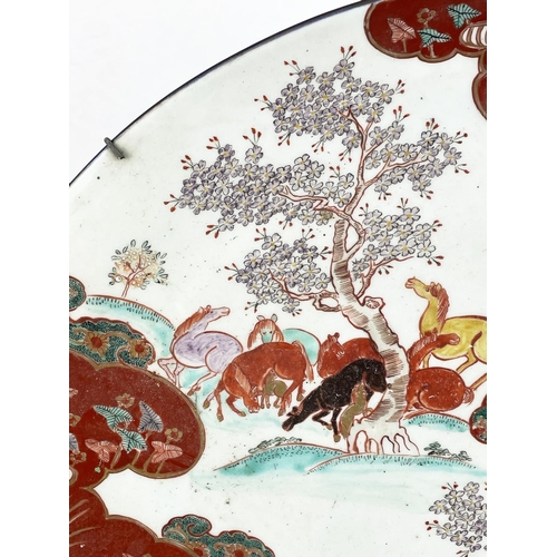 1 - LARGE JAPANESE KUTANI PORCELAIN CHARGER, late 19th century, decorated with grazing horses, character... 