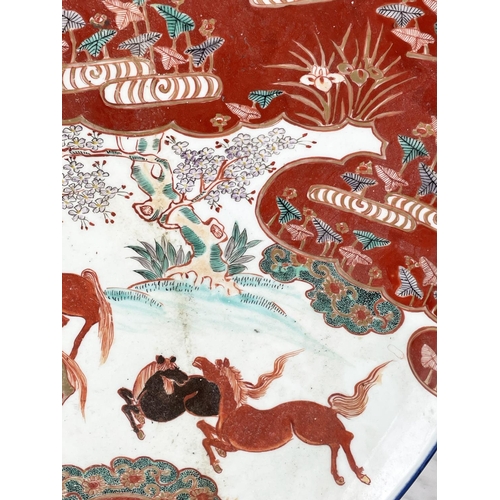 1 - LARGE JAPANESE KUTANI PORCELAIN CHARGER, late 19th century, decorated with grazing horses, character... 