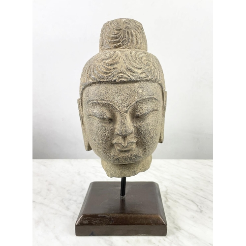 12 - A CARVED STONE BUDDHA HEAD ON STAND, an Oriental wood figure and a glazed pottery figure along with ... 