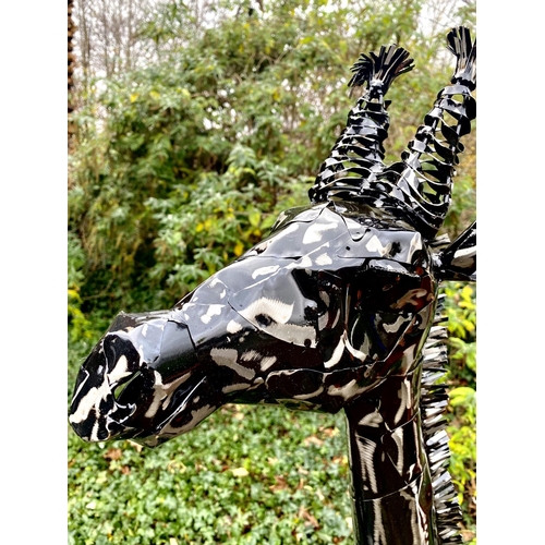 446 - SCULPTURAL GIRAFFE, two, painted metal, a larger giraffe measuring 152cm high x 120cm long x 25cm wi... 