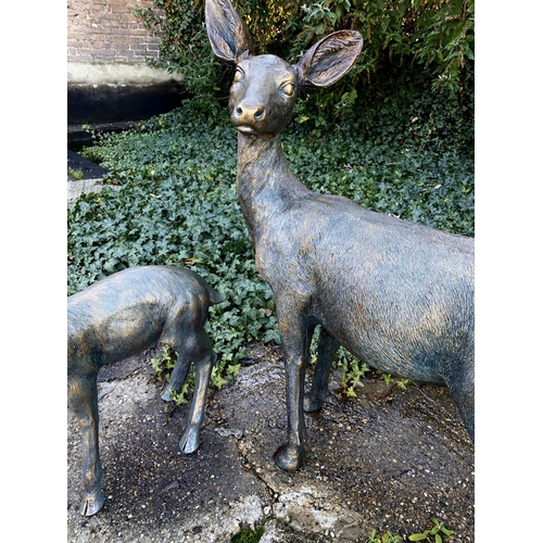 449 - CONTEMPORARY SCHOOL SCULPTURAL STUDIES, a set of two, depicting a Doe and Fawn, resin, in a bronzed ... 