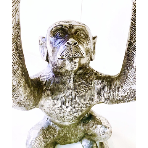 461 - Monkey figural side table, 50cm high, 44cm diameter, circular top, silvered finish.