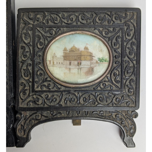 80 - INDIAN MINIATURES, a set of three, ornate carved wood frames, largest 14.5cm x 9.5cm overall. (3)