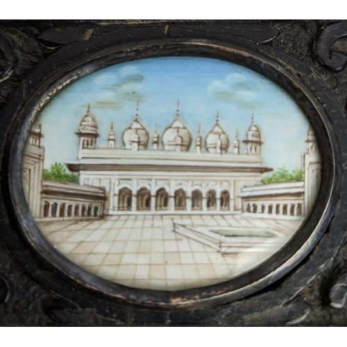 80 - INDIAN MINIATURES, a set of three, ornate carved wood frames, largest 14.5cm x 9.5cm overall. (3)