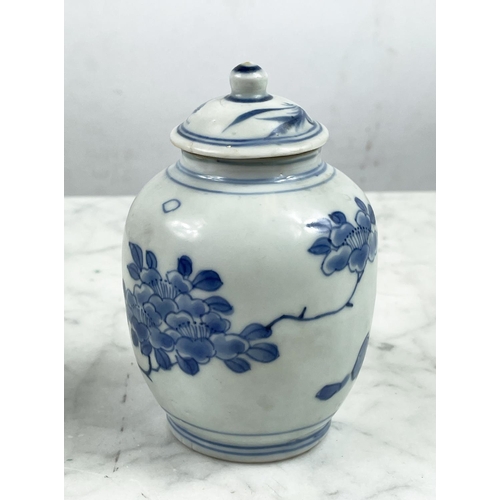 9 - HATCHER CARGO SMALL LIDDED VASES, a pair, in blue and white foliate decoration, 13cm H. (2)
