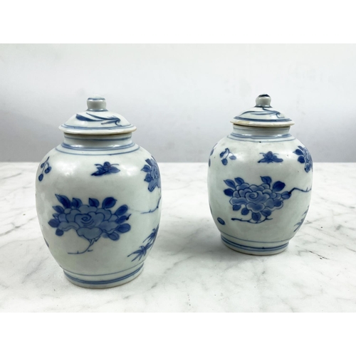 9 - HATCHER CARGO SMALL LIDDED VASES, a pair, in blue and white foliate decoration, 13cm H. (2)