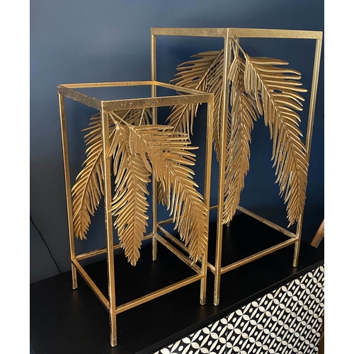 384 - SIDE TABLES, a graduated pair, 1970's Italian style, palm leaf detail, gilt metal, mirrored tops, la... 