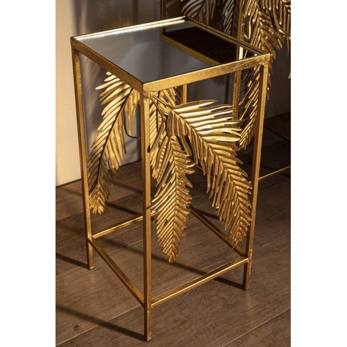 384 - SIDE TABLES, a graduated pair, 1970's Italian style, palm leaf detail, gilt metal, mirrored tops, la... 