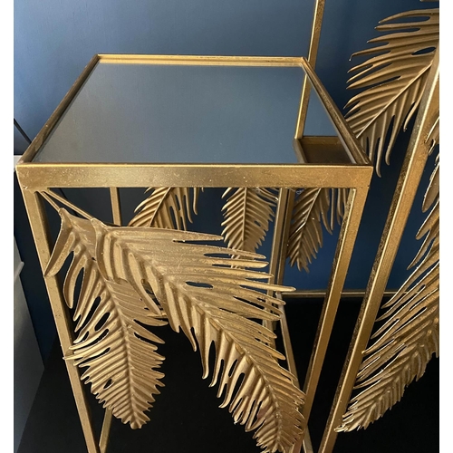 384 - SIDE TABLES, a graduated pair, 1970's Italian style, palm leaf detail, gilt metal, mirrored tops, la... 