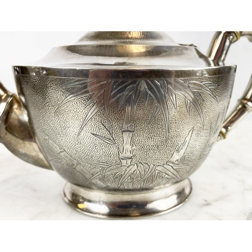 10 - CHINESE EXPORT SILVER TEA SET, c. 1940s Republic period, comprising a teapot, sugar bowl, milk jug a... 