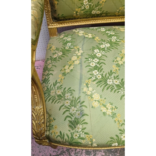 152 - LOUIS XVI STYLE GILTWOOD CANAPE, 19th century gilt gesso applied decoration, green silk floral patte... 