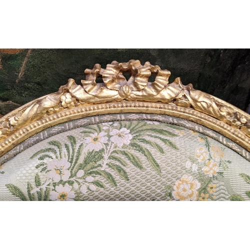 153 - LOUIS XVI STYLE BERGERE A OREILLE, 19th century gesso applied giltwood frame, green silk floral patt... 