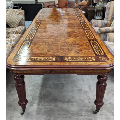 471 - EXTENDABLE DINING TABLE, walnut with inlay decoration, four leaves on reeded supports with castors, ... 