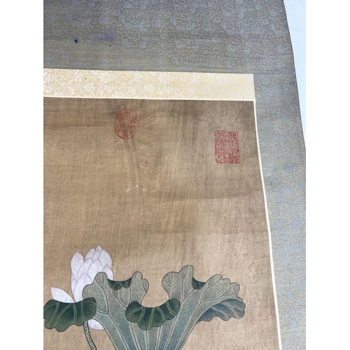 37 - CHINESE SCROLL, watercolour on silk depicting a pair of ducks beneath lotus blooms and butterflied w... 