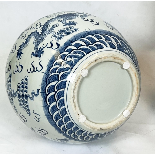 42 - CHINESE BLUE AND WHITE VASES, a pair, painted with dragons chasing the flaming pearl of wisdom, 63cm... 