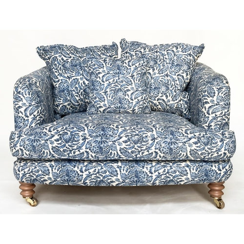 106 - RITZ SOFA, two seater in torosay indigo blue upholstery and turned front supports, 125cm W.