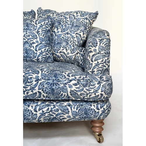 106 - RITZ SOFA, two seater in torosay indigo blue upholstery and turned front supports, 125cm W.