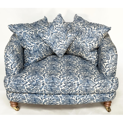 106 - RITZ SOFA, two seater in torosay indigo blue upholstery and turned front supports, 125cm W.