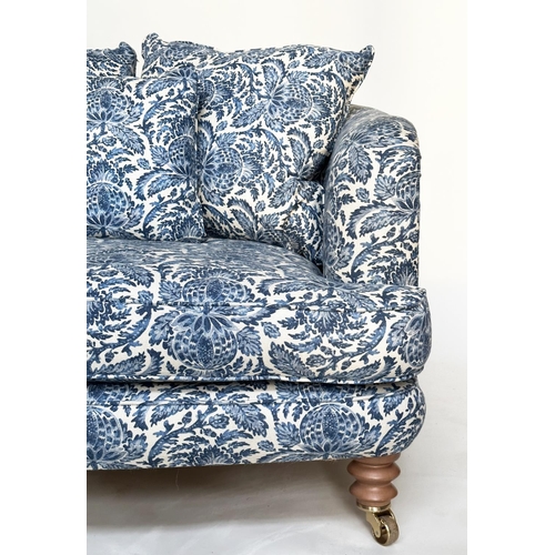 106 - RITZ SOFA, two seater in torosay indigo blue upholstery and turned front supports, 125cm W.