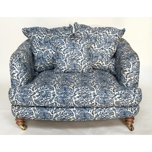 106 - RITZ SOFA, two seater in torosay indigo blue upholstery and turned front supports, 125cm W.