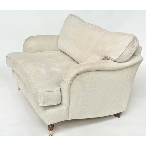 119 - HOWARD STYLE SOFA, with natural linen upholstery, feather filled cushions and turned front supports,... 