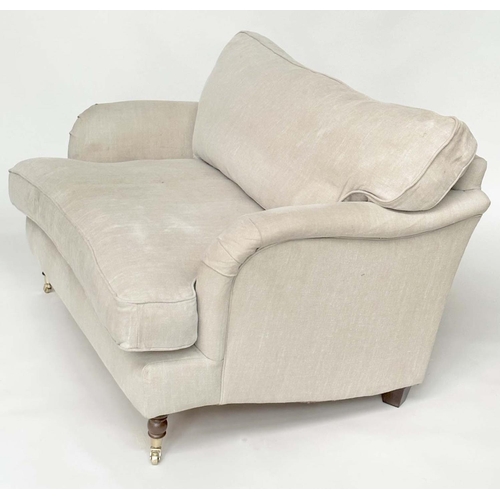 119 - HOWARD STYLE SOFA, with natural linen upholstery, feather filled cushions and turned front supports,... 