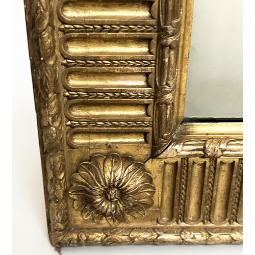 122 - WALL MIRROR, 19th century giltwood and gesso moulded with bevelled plate, rosette cornered and pater... 