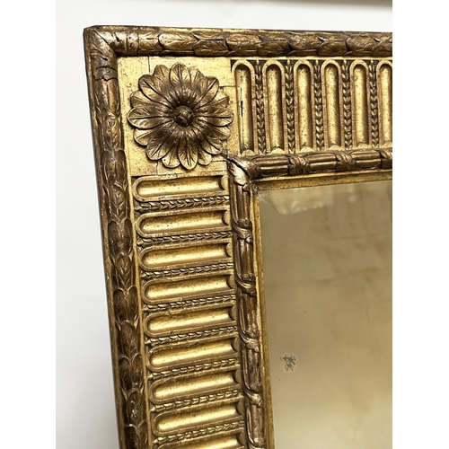 122 - WALL MIRROR, 19th century giltwood and gesso moulded with bevelled plate, rosette cornered and pater... 