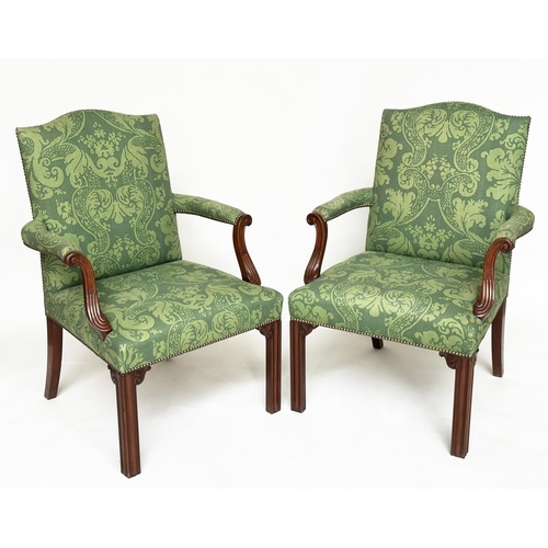 126 - GAINSBOROUGH ARMCHAIRS, a pair, George III design with arched backs, scroll carved arms and brass st... 