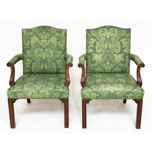 126 - GAINSBOROUGH ARMCHAIRS, a pair, George III design with arched backs, scroll carved arms and brass st... 