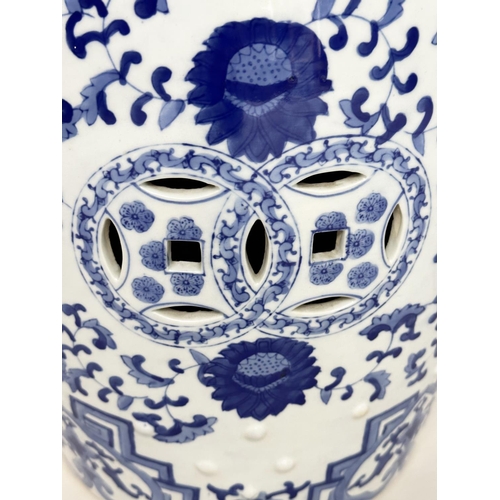 132 - CHINESE BARREL STOOLS, a pair, blue and white ceramic with pierced tops, 47cm H. (2)