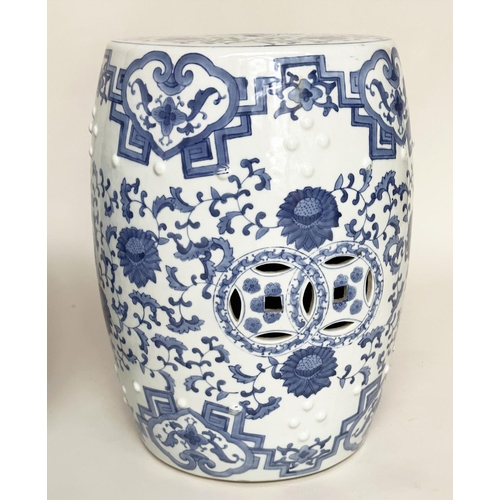 132 - CHINESE BARREL STOOLS, a pair, blue and white ceramic with pierced tops, 47cm H. (2)