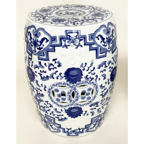 132 - CHINESE BARREL STOOLS, a pair, blue and white ceramic with pierced tops, 47cm H. (2)