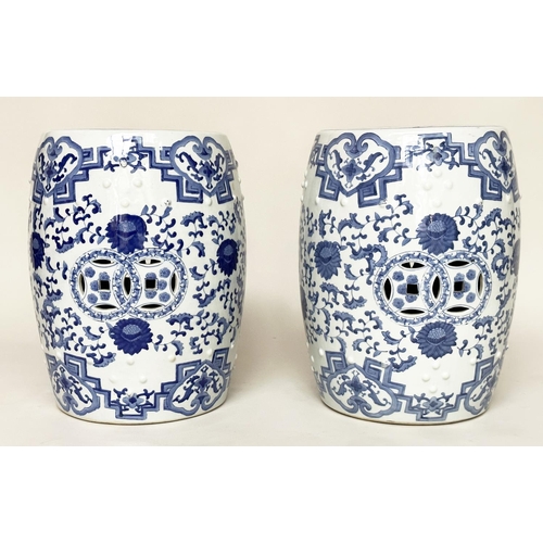 132 - CHINESE BARREL STOOLS, a pair, blue and white ceramic with pierced tops, 47cm H. (2)