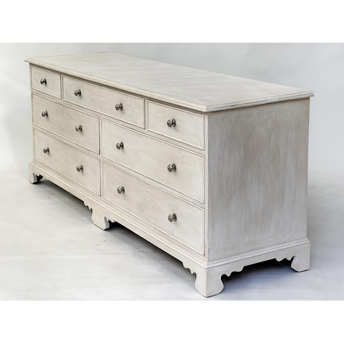 133 - LOW CHEST, Georgian style grey painted with seven drawers and bracket supports, 180cm x 47cm D x 70c... 