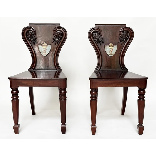 135 - HALL CHAIRS, a pair, 19th century mahogany with scroll and shield backs, coat of arms and facetted f... 