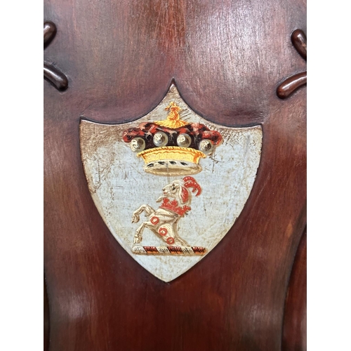 135 - HALL CHAIRS, a pair, 19th century mahogany with scroll and shield backs, coat of arms and facetted f... 