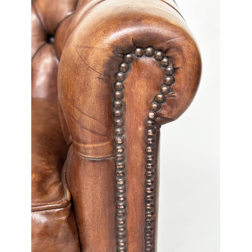 143 - TUB ARMCHAIRS, a pair, deep buttoned mid brown studded hide leather with curved back and scroll arms... 