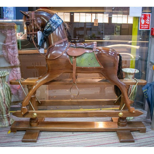 495 - STEVENSON BROTHERS ROCKING HORSE, 123cm H x 143cm L x 46cm W.