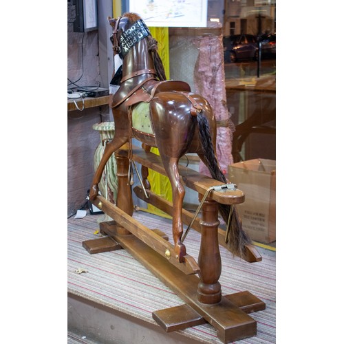 495 - STEVENSON BROTHERS ROCKING HORSE, 123cm H x 143cm L x 46cm W.