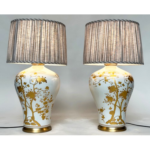 123 - TABLE LAMPS, a pair, Chinese ceramic vase form, white with fine gilded trailing shrub decoration (wi... 