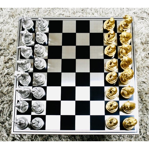 489 - CHESS SET, with silvered and gilt finish animal form pieces, 60cm x 60cm.