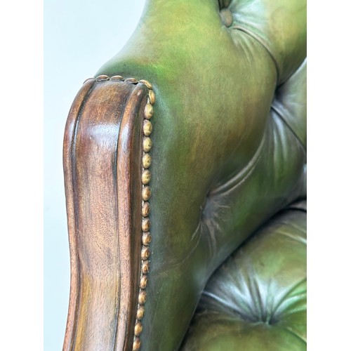 140 - ARMCHAIR, George III design mahogany with deep buttoned and studded green hide leather.