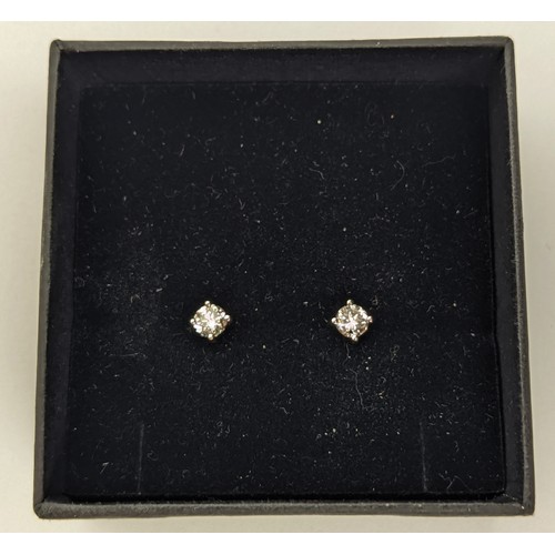 48 - A PAIR OF 18CT WHITE GOLD DIAMOND SOLITAIRE STUD EARRINGS, the round brilliant cut stones of a total... 