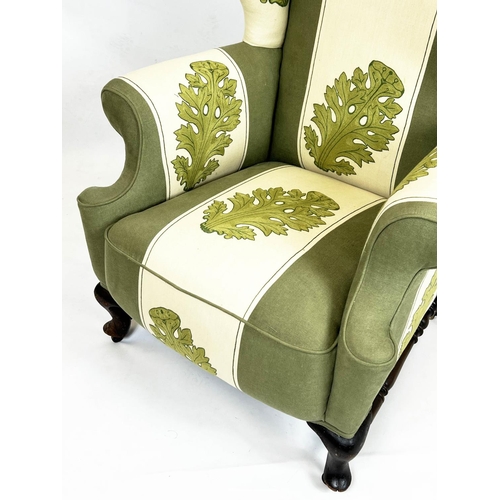 194 - WING ARMCHAIR, 118cm H x 83cm, late 19th/early 20th century, in green and cream acanthus leaf patter... 