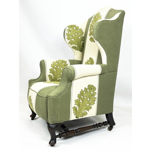 194 - WING ARMCHAIR, 118cm H x 83cm, late 19th/early 20th century, in green and cream acanthus leaf patter... 